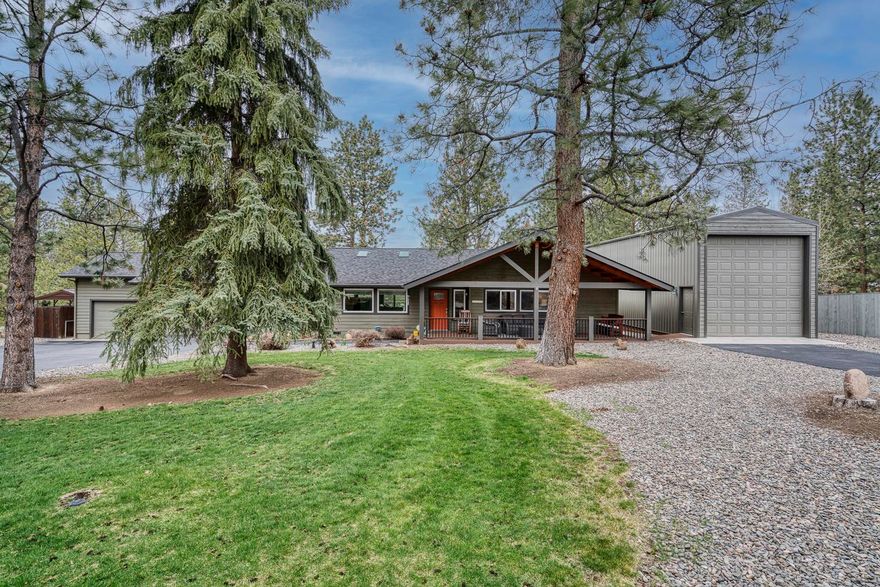 Exquisitely remodeled single-level home in desirable Woodside Ranch. 4 bedrooms, 2 bathrooms, primary on the main, bonus room above the large 3-car 
garage. One bedroom is currently being used as an office. Environmentally friendly, all electric heating and cooling systems with new wiring throughout. Light and airy design with skylights and open living areas. Spacious modern kitchen, stainless steel appliances, granite counter tops and hardwood floors.
Gorgeous views from the new TimberTech deck in back with large, retractable awning. Custom TimberTech covered front porch and spacious entry way.
Professionally landscaped and terraced 1.07 acre lot with large pine trees, gorgeous lawns front and rear. Fenced yard backs to a lovely seasonal irrigation
canal. Plenty of parking with a boat storage and a separate large insulated RV garage with its own driveway. This home is in immaculate condition throughout, you will not want to miss this rare find in Woodside Ranch!