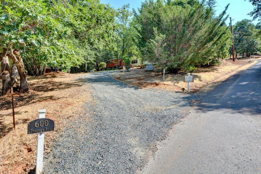 Want privacy and a little bit of the country life?  Come enjoy this private and beautiful mountain side home on 1 acre.  Now is your opportunity to enjoy a very comfortable home with outbuildings for those special projects/hobbies, at an affordable price!!  This home has a metal roof, has been completely updated with new appliances, on demand water heater, new flooring, lights, fans and drywall thru-out. Fresh kitchen with unique counter tops, beautiful woodwork & special lighting that can switch between the warm accent-led lighting and the bright-led white for the open, crisp and clean feel.  Primary bedroom has spacious bathroom with a walk in shower and  rain shower head system . Spacious covered deck with fans and a beautiful view! Tall 768 sq/ft shop built in 2002. There is a raised/fenced garden bed area & another outbuilding that could be used as a shop or storage. Great country location close to town and conveniences.