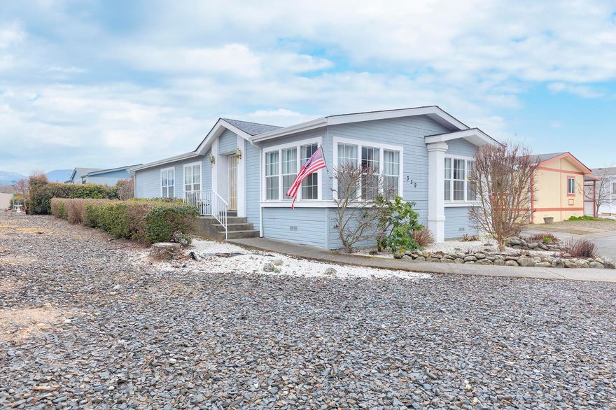 Super clean, well taken care of in park mobile home in 55+ Willow Estates Mobile Home Park. This two bedroom, two full bath home with extra living room space has a spacious primary bedroom and bathroom with additional storage space, built- in desk and breakfast nook, separate laundry room, an extra large workshop and backyard with sprinklers and green grass.
Willow Estates Mobile Home Park is a 55 and over community. Space rent is $625 and includes water and sewer. The park does allow one small pet. Any potential buyers must be approved by park management (easy process.)  Call  today to check this home out!