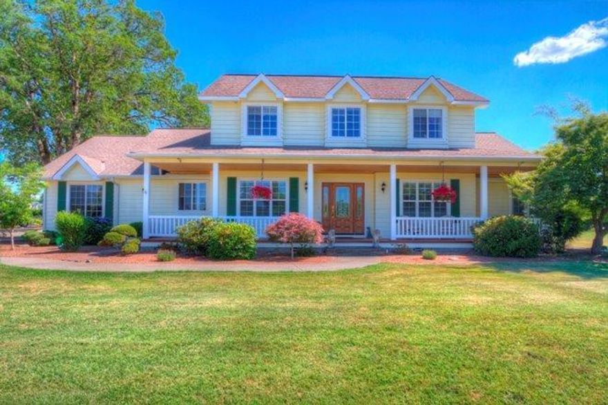 Green Acres.Country Living at it's finest. Thoughtfully upgraded and meticulously maintained, the 2800 s/f, 4BR/3.5BA custom 2-story home, built in 1994, has beautiful views of the mountains and valley. Inside, you'll find all the right amenitiessoaring ceilings, lots of windows for sun-drenched rooms, an office/den, master bedroom suite on the main level, casual eating area off a kitchen with granite counters, island and an abundance of storage. Then step out onto the covered patio and enjoy the afternoon breeze overlooking 6+ acres of level, usable land. Steps away is a gazebo with outdoor kitchen. The grounds are dotted with mature trees and outbuildings that include what was originally a 2 stall barn now being used as storage for yard implements, & a charming greenhouse, + several smaller sheds. The property is fenced and cross-fenced and includes an established garden area. Set way back from the road behind a gated entry. You'll relish the privacy that this lovely home offers!