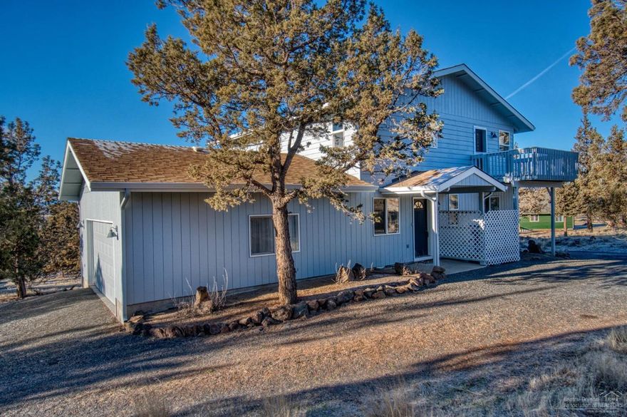 The most fabulous view can be seen from this beautiful home atop sloped 1-acre lot. 2-story home w/reverse living, to truly take advantage of these beautiful views from the entire living area. Home has engineered wood flooring &amp; propane heating stove in upstairs living space. Dbl garage enters into lower level &amp; driveway circles above home with entry into lower level &amp; stairway to upper level living space, plus master suite &amp; bath. Lower level includes lrg-family room, laundry room, full bath &amp; 2-bedrooms. Both Upper &amp; lower westerly decks are covered. Upper deck has glass windbreak, with sliding glass door entry/exit from living room, creating a full wall of glass! Lower level bedroom has slider onto lower deck, plus utility room man-door. Both decks have exterior access and propane for BBQ. Home was remodeled in 2014, with new cabinetry, countertops, flooring, paint &amp; lighting. Home has fresh exterior paint, dog pen, storage bldg &amp; RV parking and hooku