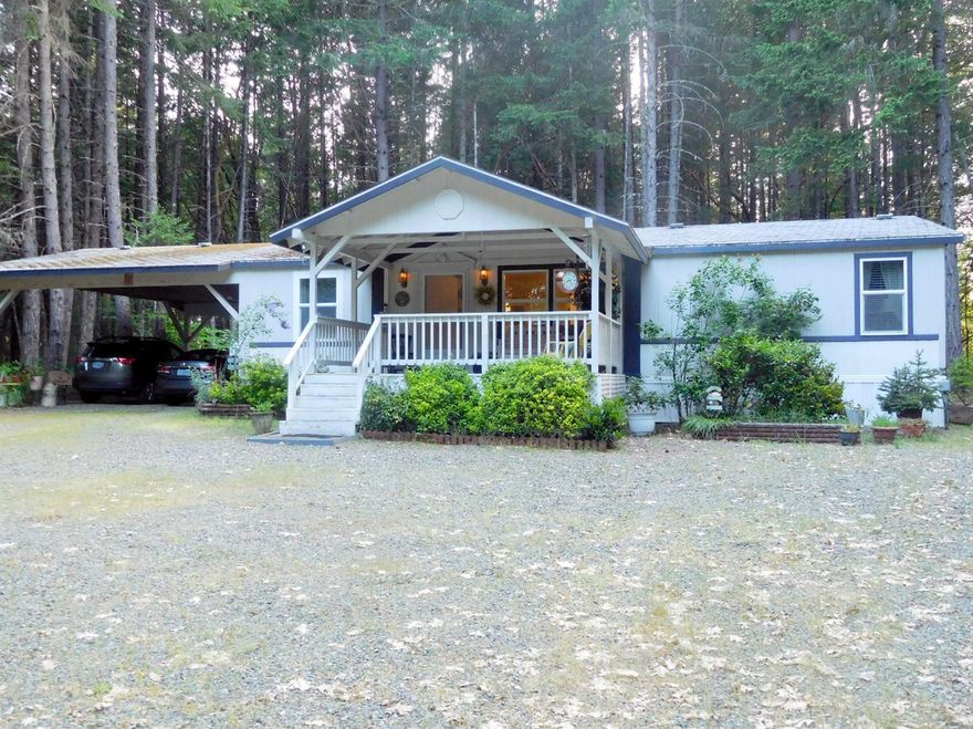 Fantastic setting for a very well maintained mfg. home, on level, heavily wooded 7.19 acres. Home has a large covered fron porch, just right for sitting in a lounge chair, or porch swing, and enjoy the beauty and wildlife. Home has a split bedroom floor plan, 2 bd on one side and master with its own bath on opposite side. Central living, kitchen/dining and living room. Kitchen includes the appliances and washer & dryer. Lots of cabinetry, and extra storage too. Master has walk in closet, and in bath, a big soaking tub and sep. stall shower. Outside, there is a double attached carport, l0 X 12 shed, that is multi-use and a sep. pump house. 30 GPM well of record when drilled. Come see this lovely home and property. Approx 5 miles from town conveniences, and 1 hour to the Oregon Coast beached, and 1 hour to international airport in Medford, Oregon. Lots of fishing, hunting, hiking, picnicing are all here in this beautiful valley to enjoy!