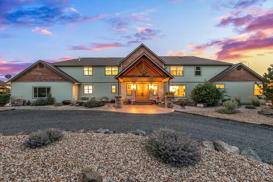 Spectacular custom home on acreage with mountain and canyon views. This 4,154 square foot 3 bedroom, 4 bath home features a large great room with amazing mountain views, custom maple floors, juniper ceilings, and huge stone fireplace. The kitchen has stainless appliances, custom hickory cabinets and granite countertops. There is a large master suite that includes a walk-in shower, soaking tub, big walk-in closet and more. Go outside and take in the spectacular valley views from the canyon rim and enjoy the custom designed landscaping. There is a massive 3,200 square foot shop with a huge loft, possible office space, full bathroom and more. Don't miss the custom barn with pull through doors, hay storage and tack room. There's a loafing shed and fenced pasture area for the horses. This is a very special one-of-a-kind property.