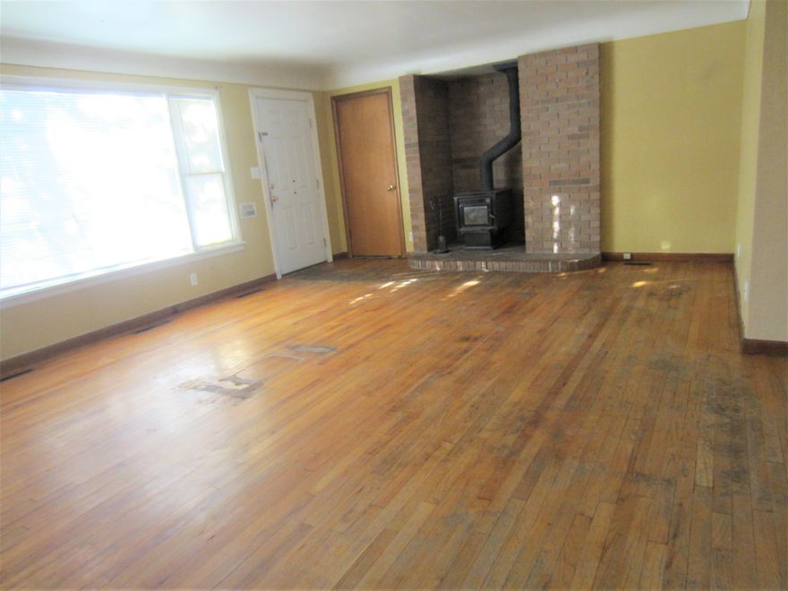 Reduced 20k! It's all about location on this one! Located in midtown just off Greenwood. Sits up against Pilot Butte on a large flat .24 acres. Fenced with a couple exterior storage sheds. Bring your DIY skills and put some sweat equity into this 1950's ranch. Garage conversion makes this a 4 bdrm home. Original hardwood floors could possibly be sanded and stained. Forced air furnace. Home is being sold as-is and will need a rehab loan or cash to purchase. Roof is less than 10 years old.