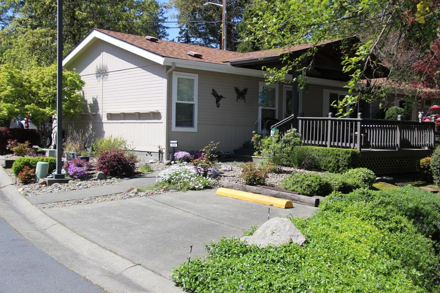 HOME IS VACANT AND READY FOR NEW BUYER TO MOVE IN. This 1996 Silvercrest manufactured home boasts 1,716 sq. ft. of comfortable living space with 3 bedrooms and 2 bathrooms. Enjoy the serene beauty of Gilbert Creek from your covered redwood deck, or relax on the second backyard deck surrounded by lush landscaping, flowers, and visiting wildlife — your own private retreat!

 Designed with an open, split-bedroom floor plan, vaulted ceilings, and abundant natural light, the home features both a living room and a family room for flexible living options.

The spacious kitchen is optimal for your cooking endeavors, while the large primary suite offers a master bath with double sinks and a handicap-accessible shower.

Additional amenities Include a carport, workbench, and storage shed.

Highland Heights Manufactured Park offers a clubhouse, and monthly space rent covers water, sewer, and trash.