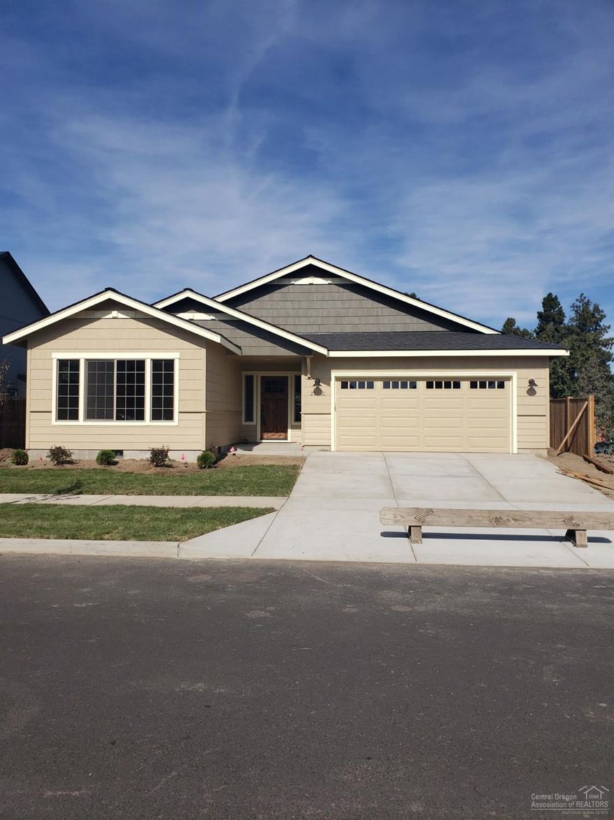 As soon as you enter this new construction, single level home, you realize this is not a production built product. Little extras such as under cabinet lighting, knotty alder trim, Knotty alder solid wood front door, under mount kitchen and bath sinks with slab quartz tops, tiled floors in baths/utility plus a custom live edge blue pine mantel on cozy gas fireplace are just a few items that make this home stand out from the rest. Laminate flooring in the great room and the 5' kitchen island, pantry & closet organizers add to the list. The back yard offers a concrete patio and fencing. Entire lot will be landscaped. Open acreage behind add a sense of privacy, the neighborhood park 2 blocks away and COID property to the east make for great areas to walk, run and play. Master separation, vaulted ceilings and lots of windows finish off the homey feel of this 1776 sq ft home.