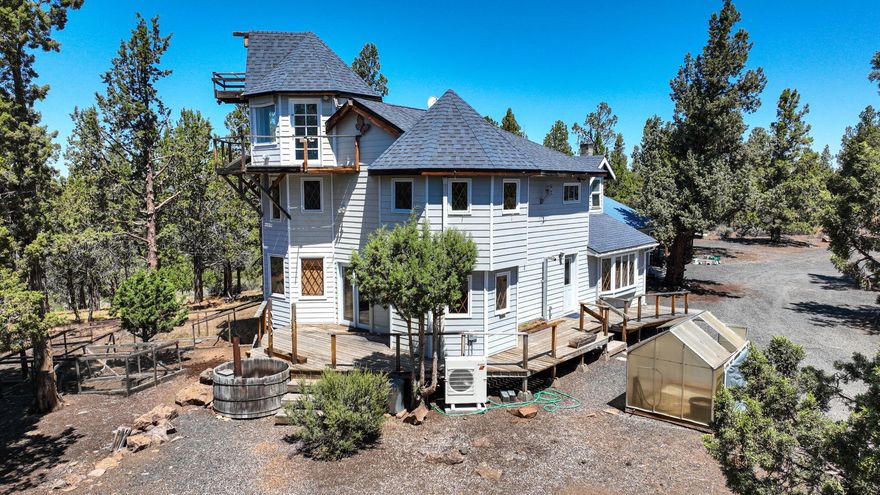 Contractor's Dream on 5+ Acres in Bend/Sisters!

Bring your vision and tools—this one's packed with potential! Unique 3 bed, 2.5 bath home with turret-style rooms, vaulted ceilings, incredible mountain views and natural light. Large recording studio. Must see! Perfect for cash buyers or rehab loan!

Bonus spaces throughout, plus a HUGE 4-bay garage, additional single-car garage, and multiple workshops.

Over 2,200 SqFt of living space + 960 SqFt garage = endless opportunity! Tucked away on a private 5.38-acre lot, yet just minutes to town.
Don't miss your chance to turn this rare gem into something truly spectacular!