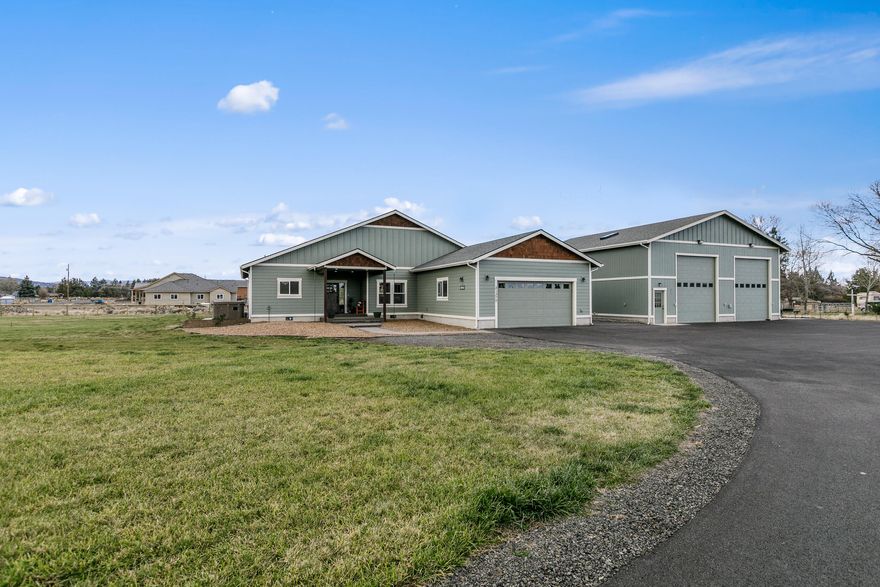Enjoy country living on the edge of town!  One of a kind single-level small acreage home w/DREAM SHOP, Mtn views, irrigation, & much more!  Built in 2020, this ideal floor plan includes an XL great room w/vaulted ceilings, dining area, expansive kitchen w/ sold-suf leathered granite counters, huge kitchen island, custom cabinets w/soft close drawers, & large pantry. Private master suite boasts vaulted ceilings, sliding doors leading to a patio & swim spa. Gorgeous master bath w/ dual vanities undermount sinks & solid-suf counters, a makeup counter, tile shower, & generous walk-in closet.  Two large bedrooms are separated by an adorable jack & Jill bath, & 4th bedroom can be used as an ensuite.  Your 40ft X48ft frame built &insulated dream shop includes two 12ft X 14ft automatic doors, four 50AMP plugs, RV dump, commercial exhaust fan, built in pneumatic compressor lines, office & 2nd room w/ full bath, laundry, sink, and cabinets & so much more.  More interior photos coming soon!