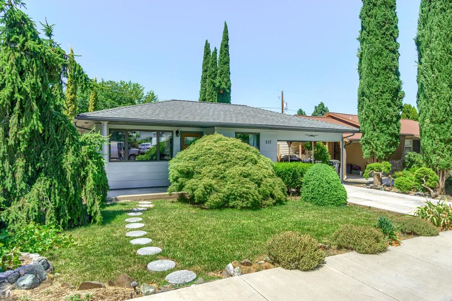Adorable 963 sqft 2 bed / 1 bath home in Old East Medford sits on .11 acre lot w/ privacy. New stainless dishwasher, new stainless induction range, new toilet, new interior paint and newly refinished tub & surround. The two cabinets in kitchen area with maple countertop are removable and could be used as they are for additional counter space or removed to increase the size of dining area. New roof in 2009 & new water heater in 2019. Curb appeal is top notch w/ beautiful landscaping in front. Nice attached carport w/plenty of parking in driveway along with storage shed. Classic hardwood floors throughout w/ additional porcelain tile flooring. This home gets lots of natural light & has lots of charm with wood accent trim. The private fenced backyard has enough space to park a small RV from paved alley access.