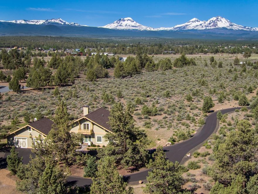 Panoramic Cascade Mountain Views from custom home on 10 acres. Traditional Style home is 2903 sq ft, 4 bedrooms, 2.5 bathrooms, main floor living, 9ft ceilings, living room with KIVA wood fireplace, quality kitchen, dining room, master suite, wood finishes and built ins throughout home. Wonderful outdoor living with covered patio, landscaped with irrigation system. Two car oversized garage with work area, generator and paved driveway. Property is low maintenance with native plants and trees, located between Sisters and Bend. Come enjoy the unobstructed views in the heart of Central Oregon!