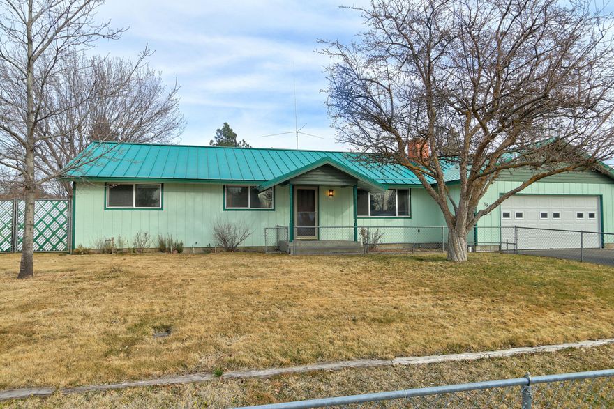 South Suburban home on large fenced in lot. Front yard fenced in as well as back yard. 3 Storage sheds, ample room for RVs on both Sides of house with gate access from the street and driveway. Home has communication tower; although the equipment has long been removed. Sale is an estate sale, commissions will not be paid on contribution.  Please allow 2 day response time for attorney review.