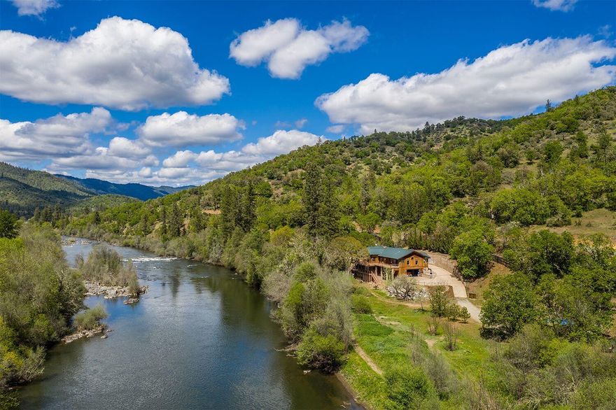 Located near the Hardy Riffle Rapids is this gorgeous 2001 Timber Lodge style home with decks overlooking the spectacular Rogue River with scenic views & approximately 1600 feet of frontage. This 8.86 acres enjoys wildlife, horseback/ walking trails that bring you down to rivers edge with sandy beach access points along the way. The custom 1 owner home offers floor to ceiling stacked stone fireplace with dumbwaiter wood box & open wood beam ceilings. Entertainers dream kitchen overlooks the river view with custom island & gorgeous cabinetry topped with Brazilian stone granite and subzero fridge & freezer, a maid's closet & pantry. With 2743 Sq. ft, this 4 bedroom 3.5 bath home has a separate entranced daylight basement, it would be ez to have 2 family set up or VRBO potential. Library with custom cabinetry & murphy bed for guests. Barn, pastures, round pen, custom outbuilding (w/ water & electricity) & an area for a future swimming pool. Gated farm entry for hay delivery & RV parking