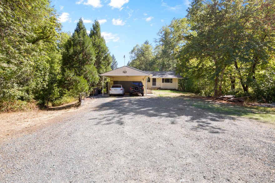 Don't miss this opportunity to own this large 2.85-acre property with 500ft of year-round creek frontage, that brings in the joys of the country living and charm. Plus all the major items are taken care of for you before you move in including a BRAND NEW roof, updated bathroom features, a brand new septic, a new water tank, and new Ion Pro AirCat filtration system for water with a well that tested at an average of 18 GPM for four hours in 2022. You can also enjoy water rights with this property as well for your fruit trees and livestock etc. This is a beautiful property and a MUST SEE!