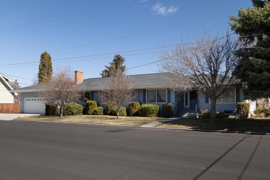 Located in the heart of Prineville, this 4328  sq ft home is a wonderful place to create your own memories.  Great neighborhood near schools and churches and just a short walk to local parks. Main floor has 2332 sq ft with  3 bedrooms and 2 full baths, a living room with a gas fireplace and a great room with a wood fireplace insert.  All kitchen appliances and the washer/dryer are included. The enormous downstairs is 1996 sq ft completely finished and has a full bath with 7 rooms that includes a pool table and a ping pong table.  Covered patio for outdoor entertaining with a hot tub that has a built-in stereo. Two car heated garage with storage cabinets and refrigerator. Room to park a 36 ft motor coach.  Outdoor yard irrigation from the well.  Nice corner lot all fenced.   Don't hesitate to make an appt. today...this is a must see !!