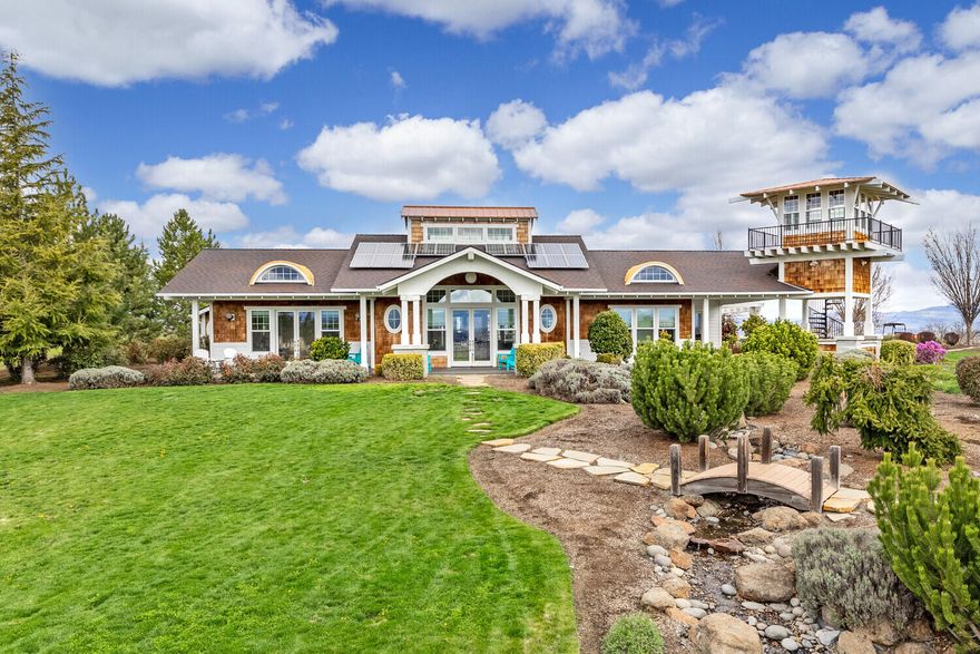 SELLER WILL CONSIDER BACKUP OFFERS. 
 Incredible custom home with many recent upgrades on an 10.34 acre horse property with valley and mountain views.  This light-filled nearly 4K sf home has four bedrooms, three bathrooms and a wonderful floor plan that invites indoor/outdoor living. The great room has vaulted ceilings, exposed beams, and connects to the internal courtyard - the perfect place for gatherings. The chef's kitchen has a large central island, granite countertops and stainless steel appliances. Patio has a built in kitchen perfect for entertaining outdoors. A lookout tower provides views of the Rogue Valley and can be used as a home office, art or exercise studio. The outdoor options are numerous with a 5 stall barn, 4 paddocks, 7 acres of irrigated hay fields, fully fenced property and farm infrastructure. With a solar array and Star Link internet, this home is both efficient and well-connected.