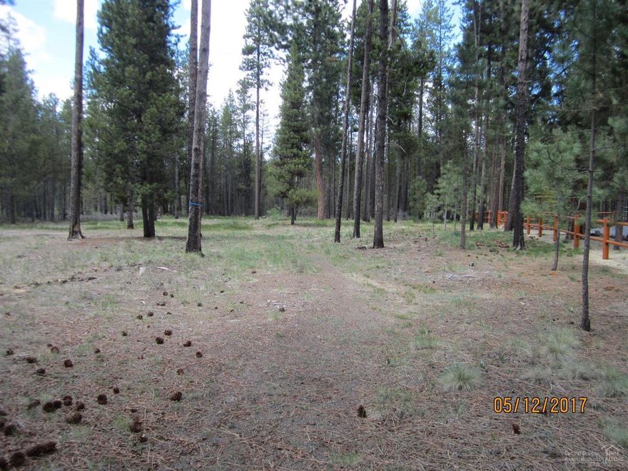 Ready to go! 1 Acre lot with privacy in back, located on quiet cul-de-sac with nice stick built homes. Never used Well and Concrete 1000 gal. Septic are in and Lot has been cleared. Access to Club House, Swimming pool and the Little Deschutes River. Close to hunting, fishing and many lakes.