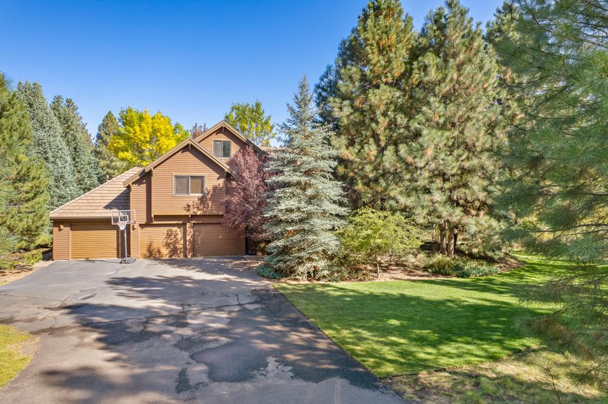 Rare offering in the highly sought-after Sunrise Village neighborhood, close to everything Bend! This home is nestled on a private .77ac park like setting w/established landscaping, soaring pine trees, & water feature.  Enjoy the bountiful wildlife: deer, quail, rabbits & more!  All from your breakfast nook.  Floorplan offers 3,661sf w/4 beds, 3.5 baths, office, two bonus rooms, family room, living room w/dining area & walk in closets. Additional features include wood floors, granite countertops, vaulted ceilings, gas FP & central vac system. All beds are upstairs including the Primary suite w/jetted tub. Expansive outdoor living space includes wrap around paver patio. Extra deep 3-car garage w/tons of storage for all your rec gear. Gated neighborhood amenities include River access, walking/biking trails, pool, hot tub, clubhouse, tennis courts & playground. Close to schools, Old Mill & downtown. Only one stop sign between you & Mt Bachelor & the beautiful Cascade Lakes.