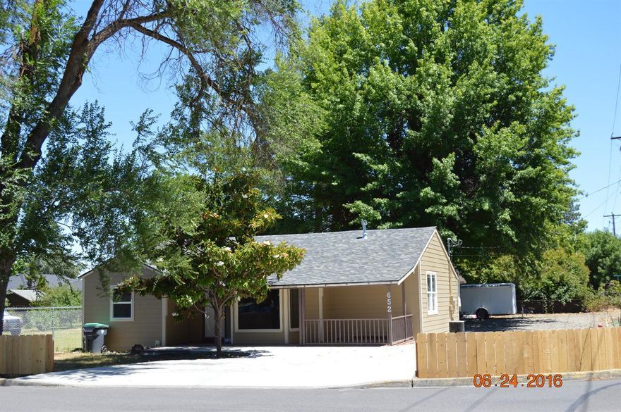 New Home inside and out. Complete remodel to the studs with new siding & roof, furnace, plumbing, electrical, light fixtures. Interior drywall, paint, appliances. Totally renovated 3 bedroom, 2 bath. Zoned R-2 detached garage/shop.Zoned R2 . Granite counter tops, new master with walk in closet, New flooring, covered patio with recessed lighting and built in blue tooth speakers, new driveway with pavers, new fence.