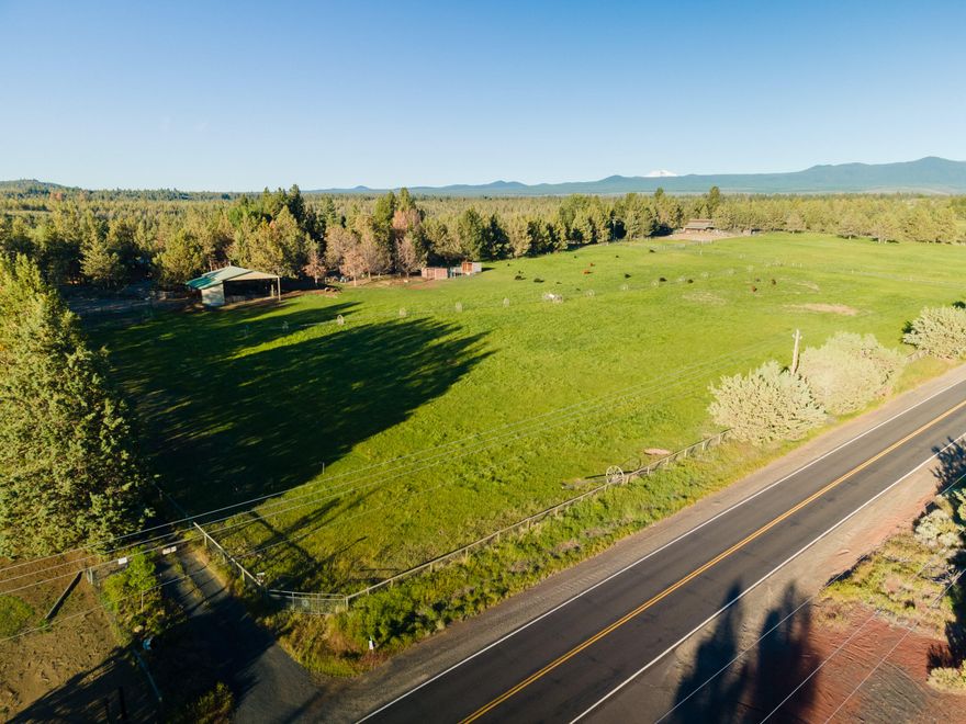 Amazing opportunity to own your own slice of paradise on Tumalo Reservoir Rd. Beautiful 20 acre property nestled in an area of multi-million dollar homes! Bring your creativity and vision to this 3 bed/2bath unique, rustic home complete with enchanting backyard, pool and old growth juniper trees. Tons of character and country charm!  Property includes 7 acres of irrigated pasture, fenced/cross fenced, custom catio, tons of outbuildings including 2 barns, set up for horses, cows, chickens and more. Home and property are in need of TLC and priced accordingly, home and property are being sold ''As-Is''.