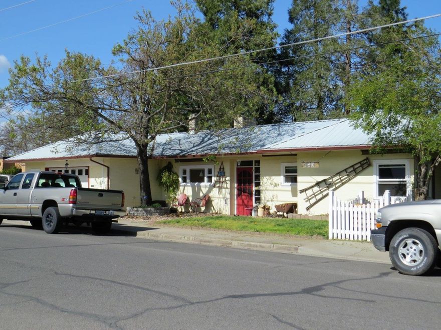 Your own little country feel property right in Central Point! This home has charm and a terrific back yard! Enjoy the covered patio and mature shade trees in the afternoon. Spring time flowers are blooming and the raised garden beds are ready for summer planting. There is even a small chicken coop and pen! Down the path is a great little shop or hobby room. In the home you will find slate floors in the dining room and entry, tile in the kitchen and bathroom and a rock wall with a wood stove. The kitchen has new cupboards and beautiful counter tops. New windows, Natural gas heating and an oversized two car garage. This single level home is in a great location and has so much to offer!