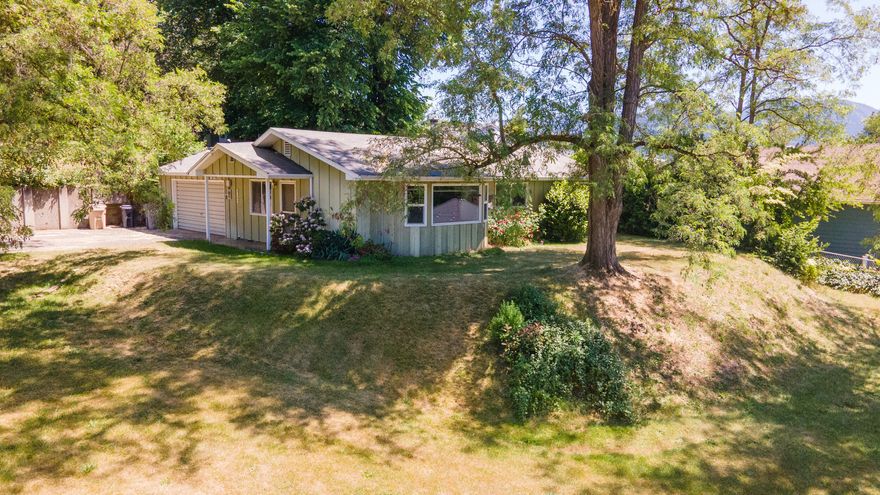 Rare opportunity on the desirable north end of Grants Pass! This well-maintained 3 bed, 1 bath home sits on a rare 1.14 acre sloped lot with subdivision potential (buyer to verify). Features include a spacious 2-car garage with an attached workshop, plus multiple outbuildings for storage and gardening. The home is in solid original condition, ideal for first-time buyers ready to build sweat equity or developers looking for a prime investment. Irrigated and conveniently located near schools, shopping, and more. Large parcels like this are hard to find inside city limits- don't miss your chance!