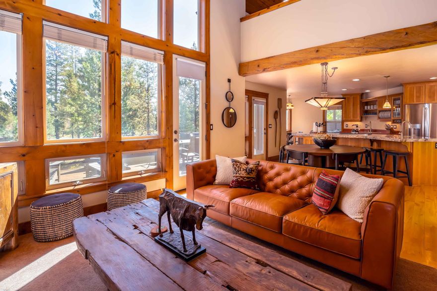 Mountain rustic describes this meticulously designed stunning custom resort home. Fresh natural spaces all lovingly cared for. Hand hewn local thick timber beams, locally quarried floor to ceiling rock fireplace with a reclaimed mantel, 140-160-year-old kitchen floor tiles from Santa Cruz, locally milled eastern hard rock maple floors, solid hemlock interior doors, locally made southern hickory cabinets , and 1940's glass block shower wall are just some of the many interesting architectural design features. Great room design boasts vaulted wood ceilings. Two oversized primary suites with window vault designs, spacious walk-in closets, and both bathrooms ensuite. Large bunk room upstairs along with a spacious game/ media loft with additional sleeping and full bath. Garage has been artfully painted for added fun. Fully furnished this home has all the required elements for a successful rental property or a second home.  Rental revenue available upon request. Call today for your showing