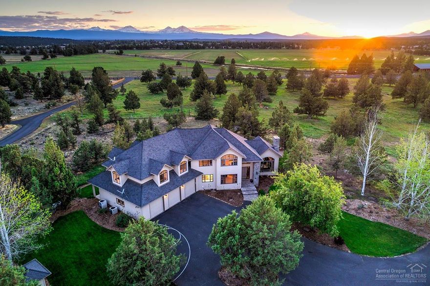 Come enjoy the peace, privacy & beautiful Cascade mtn. views of this timeless quality home boasting 5 bedrooms, office, formal & informal living & dining areas, huge bonus room, 3 full baths & 2 half baths, bright updated open kitchen w/ Thermador cooktop & SubZero fridge, massive laundry room, wine room, propane & wood burning fireplaces, separate shop area in the oversized 3 car garage on a paved driveway. There is also a HUGE shop/barn and 16.74 acres w/ mostly underground irrigation and fenced pasture.