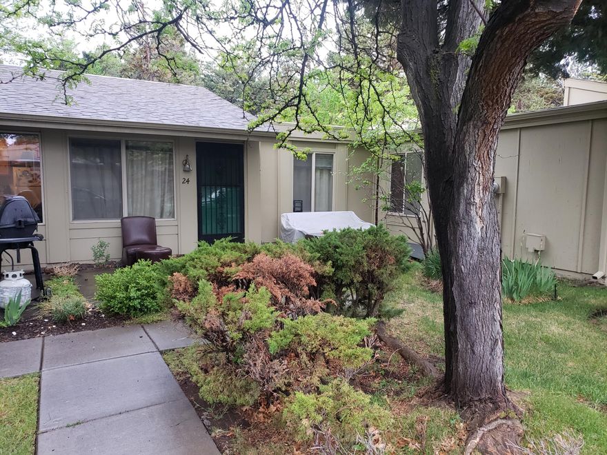 Adorable updated single level condo on the NE side of Bend is ready for a new owner. Kitchen features soft close cabinets with ample storage, granite countertops, and laminate flooring.  Unit includes its own washer and dryer, a mini-split HVAC, and offers an open floor plan with a vaulted ceiling in the living area.  Enjoy this park-like community as the deer graze from your very own patio.  Parking is directly in front of the unit. HOA includes water, sewer, garbage, an on-storage unit, all exterior maintenance, and snow removal.  Call for your private showing today!