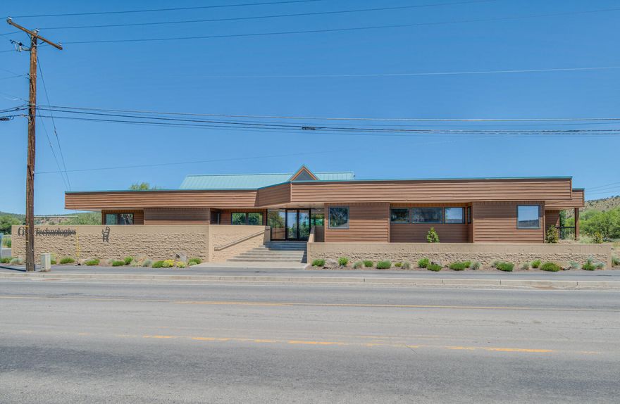 Originally built as Ochoco Lumber's headquarters, the building exhibits architecture and quality construction with beautiful wood finishes throughout. Excellent opportunity for owner/user office or medical user to join the Ochoco Mill Development, a 28 AC master plan anchored by St. Charles Prineville. Highly visible from Combs Flat Rd the thoroughfare from Third St to St Charles Prineville medical campus. 
Built in 1974 and remodeled in 1993, this office building is constructed with brick and wood frame. High-efficiency mini-split heating and cooling is on the main level and forced air is on the lower level.  
Updates include LED lighting and native landscaping with drip irrigation. Beautiful paver patio with fire pit plus territorial and creek views. 
Nearby development includes the multi-tenant retail center occupied by regional and national tenants. Also nearby are the newly constructed Wilco and Walgreens. Upcoming development includes a 312 unit multifamily development.