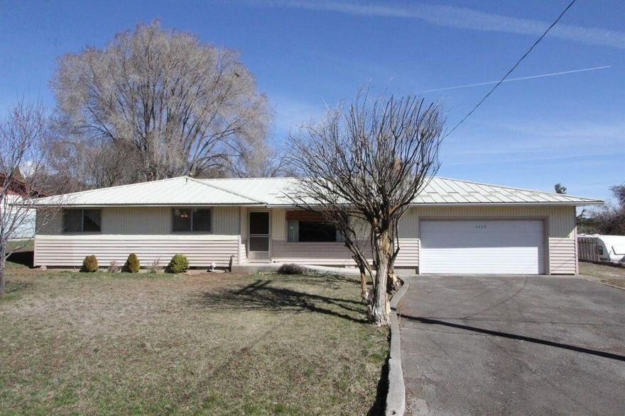 Ranch Style home, 2 bedroom 2 Bath 
 Open Floor plan, dining room right off kitchen.  Attached 2 car garage. Large RV parking.  Forced air and heat.  Mature landscaping fenced back yard.