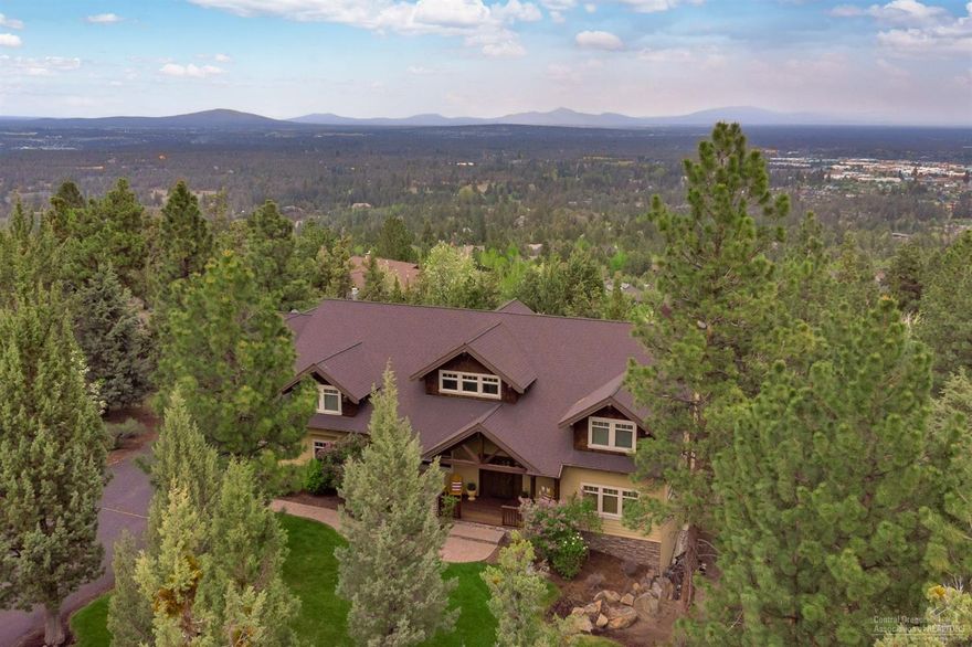 Stunning, custom home with sweeping, panoramic views from Smith Rock to Pilot Butte on private .7 acre lot. This outstanding floor plan is perfect for entertaining! French doors in living and dining areas open to spectacular deck with beautiful, built-in grilling area. Amazing kitchen with huge center island, coffee bar, and gourmet appliances; grand living room with soaring ceilings and impressive stone fireplace; spacious master suite with balcony, huge walk-in shower and jetted tub; and large bonus room above over-sized, 3 car garage. 606 sq. ft. daylight basement almost complete and plumbed for additional bathroom, not included in sq. footage.