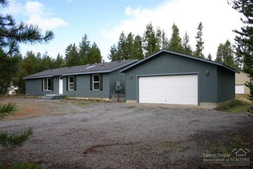 NW gem - Shop, Garage, Storage Bldg & move in ready House! Spacious home w/2 living areas, open kitchen, Master separation & lg rooms. Vaulted ceilings, tons of windows & Skylights in kitchen & guest bath bring daylight in. New front door, decks & tiled entry. 1+ acres w/ private well, plenty of space to do as you please. Detached double garage & additional SHOP both have epoxied floors. Storage shed for garden tools, fenced organic garden & worm bed. Located just minutes from State Park & trails -Call now!