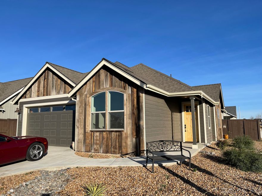 Light and bright and a warm feeling greet you when you step into this one year new home.  The open floor plan with 9'-10' ceilings with upgrades such as additional windows in the great room and the entry bring maximum light into the home. Don't let the 2 bdrms fool you as the Flex-Room can be dining or den or 3rd bdrm.  The spacious kitchen offers a beautiful island with room for 4 at the breakfast bar and a large pantry so you won't have to worry about storage.  The home is Earth Advantage Certified which provides low heating and cooling costs.    The main bdrm/bath is spacious with heated floors in the bathroom, easily maintained floor to ceiling tile in the shower and upgraded insulation in the interior walls for privacy.  You will enjoy the fully finished 2 car garage with man-door upgrade, covered patio for BBQ's all year and a nicely landscaped, fenced yard with plenty of grass to host the neighborhood corn-hole contest.   You will love this corner lot home and the community.