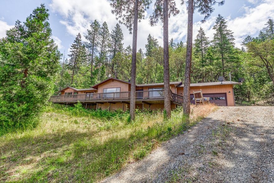 Majestic mountain views and beautiful sunsets from this amazing home.  Featuring a 1 level, 3 bedroom, 2 bath home with 2596 sf.  The cook in the family will love the kitchen with newer stainless appliances, pantry, concrete counters, pot filler, skylight, wood floors of reclaimed lumber, island, dining area and an abundance of cabinets.  Large picture windows to take in the views.  Cozy wood stove and mini splits. En-suite bedroom master is large and welcoming.  Your own private get-away with tile shower, soaking tub, dual vessel sinks, heated tile floor, walk-in closets with organizers, ceiling fan and French doors to the expansive deck.  New 200 amp main electrical with new breakers and copper wiring.  Attached 2 car garage and deck is great spot for entertaining family and friends. Great location and proximity to hospital and shopping.   Low County taxes.   Put this one on your list to show.  Home warranty up to $550 for Buyer.