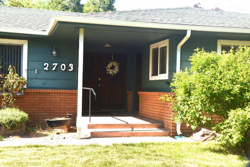 Expansive 4 bedroom 2 bath  ranch home with spacious rooms makes for very  comfortable living. Quite neighborhood conveniently located close to shopping and schools. Unique 6 bay pull through garage with workshop area. RV parking is  accessed from alley in rear. Front bedroom has separate exterior access.  Entertain your guests in the formal dining room and large step-down  living room.  Indoor plant trellis stays with the home. Skylights in family room let in natural light. Large deck off master bedroom leads to private backyard. Home has recently been renovated with new interior paint, flooring and tile in the master bathroom.