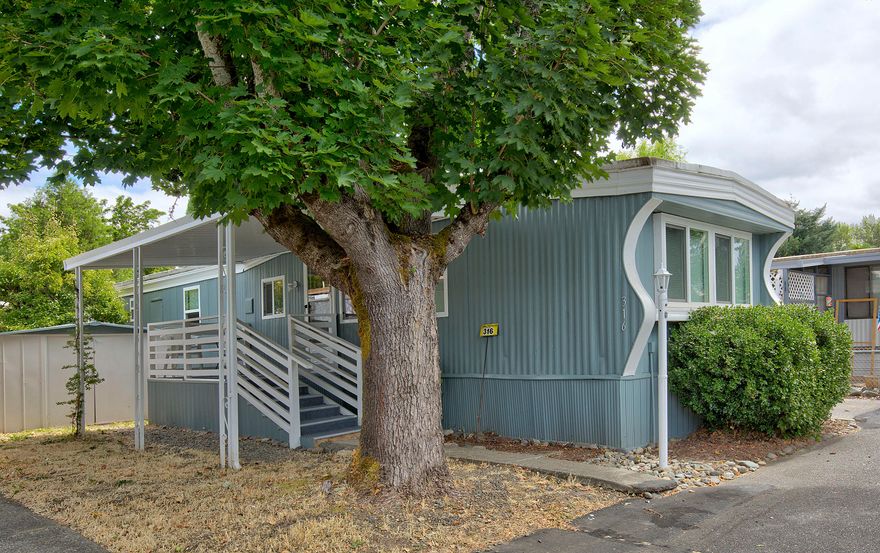 Nice, updated 2 bedroom, 1 bath single wide in 55+ park that is located on the Rogue River. In 2019, interior and exterior of the home were freshly painted, new flooring installed. Heat pump new in 2016, and propane heater. Nice decks at both front and back entries, with plenty of room to enjoy the peaceful feeling of this park. Just minutes from town in a lovely country setting. The space rent is $595 per month, and includes water, sewer, and trash. Buyers must apply for approval by Park Management. Pets are allowed with some restrictions. The listing agents are related to the seller.