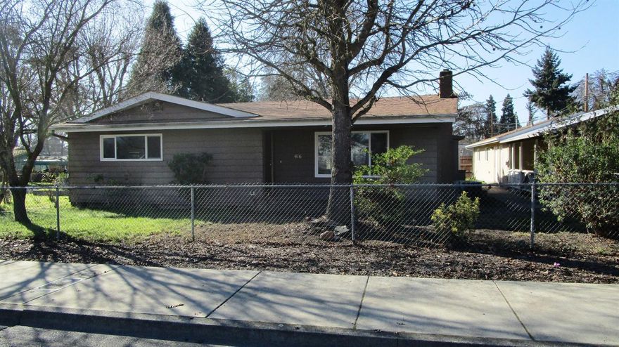 Two (2) bedroom, one and a half bath home on large corner lot. Living room with a fireplace and a separate family room. Large carport, RV parking and a detached garage with additional space for a workshop/hobby room.