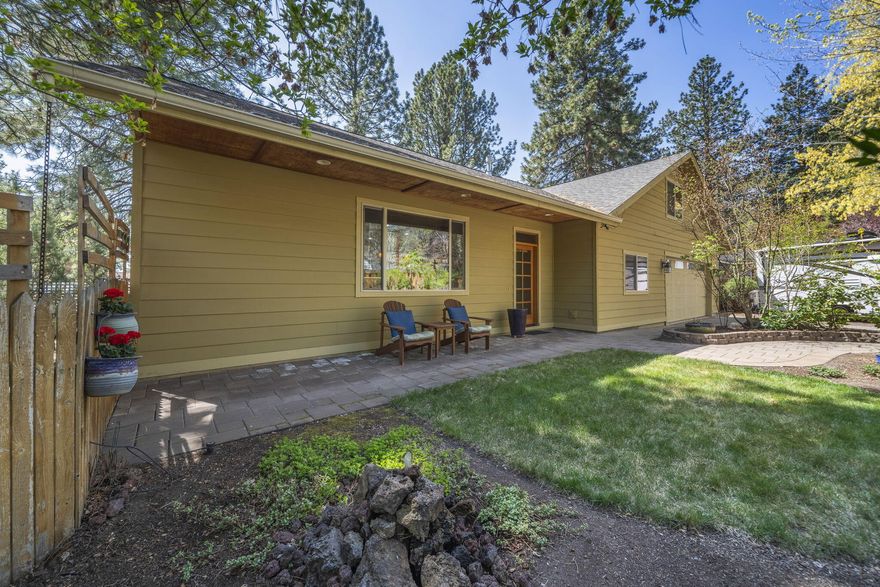 Located on a quiet tree lined street in the established West Hills neighborhood. This beautifully maintained home offers comfort and charm both inside and out. With 4 bedrooms, 2 bathrooms, and 2038 sq ft, this home is filled with stylish touches, including gleaming reclaimed oak hardwood floors throughout and a spacious Great Room perfect for relaxing or entertaining. Most rooms are on the main floor including the primary suite. Upstairs is a versatile bonus room—currently a fun game room, perfect for hobbies, guests, or a home office. Built in 2004 on a fully fenced .22-acre lot. Stunning gardens in both front and side yards, including a calming water feature, lush landscaping, and raised beds for the avid gardener. Enjoy relaxing with a private hot tub, or on the peaceful side patio. The oversized two-car garage includes a built-in workshop area, a flat driveway, and extra side parking make room for your RV or other toys. Don't miss the chance to own this move-in-ready gem.