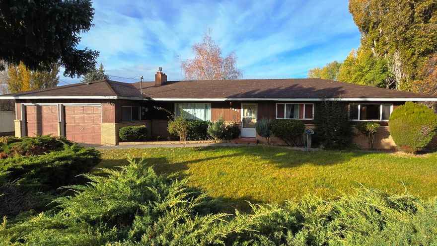 Three bedroom, two bath home on a large lot with a one bedroom, one bath guest house. Large attached two car garage with paved driveway and extra spacious graveled parking. Newer roof. Hard surface counters in the kitchen. Ceiling fans, gas fireplace, walk-in shower  in primary bedroom, built-in oven and cooktop, covered trex deck.  Large office could easily be an additional bedroom or family room with its own entrance.