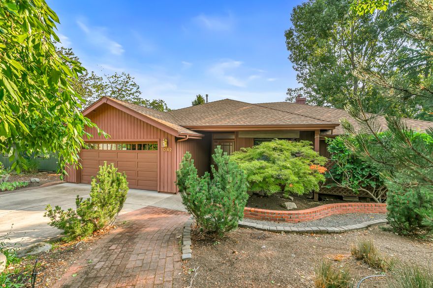 Oak Knoll neighborhood with privacy & plenty of open space. Entering the Living room, you are greeted with mountain views & natural sunlight provided by vaulted ceiling, skylights & large windows. Maple flooring & a gas fireplace for those chilly fall & winter days. Main level provides you with a large primary bedroom, spacious dual vanity bathroom, two guest bedrooms, a large kitchen with separate eating area or additional dining area. Enjoy a covered main level patio for entertaining friends or relaxing with your favorite book. Downstairs has 1300 sq ft of fully furnished spacious living with an additional primary guest suite, Livingroom, jacuzzi tub, wet bar, radiant flooring & a walk-out patio for family or guests to enjoy. Opportunity for workshop or large storage area. Super-efficient heat pump, on-demand tankless hot water heater for more energy savings. Close to YMCA, shopping & golf course.