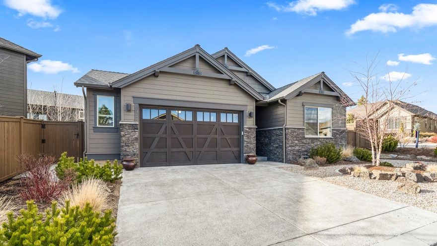 This stunning, light filled Pahlisch home sits in the desirable River's Edge Golf Community. The great room design maximizes its square footage with luxury finish work throughout including hardwood floors, a gas fireplace, skylights, tall ceilings, & large windows. Views from the great room look out to the oversized patio with Versailles pattern pavers, that is set just below street level, allowing an exceptional
sense of privacy. The open kitchen boasts rich wood cabinets, quartz countertops, stainless steel appliances, a walk-in pantry, & direct access to another outdoor space to enjoy the hot tub and long open area for a dog run if desired. Also located on the first level is the master suite, the office (or 4th bedroom), a full guest bathroom, laundry room, & garage. The second level has 2 bedrooms, a full bathroom, and a bonus room/loft. With a custom-built tool area & work bench, 3 ceiling storage racks, & 2 kayak/canoe lift hoists- there is plenty of room to store all your toys.