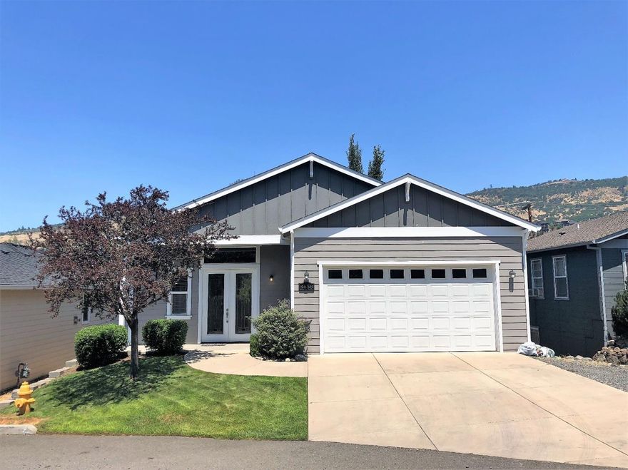 Gorgeous Home & Location - Tucked-Away on a Private Road in the Very Desirable East Medford Hills - Main Level Open Floor Plan - Main Level Master Suite -Totally Custom-Built w/Incredible Views From the Entire Back of the Home. Originally Built by the Contractor for Himself. Living room opens to a covered view deck that wraps around to the large master suite. Tons of upgrades & extras. Custom crown molding & window trim package, beautiful kitchen w/slab granite counters & Stainless Steel appliances, gas fireplace w/slate surround & custom mantel, high end'' real hardwood flooring, natural Beech wood cabinetry, 12' ceilings, some 8' doors +more. The master suite features a soaking tub, glass-surround shower, double vanity, walk-in closet w/custom closet pkg + a second closet. Lower level features two additional bedrooms w/custom closet packages, full bath & exit to covered patio. Fully landscaped front & back yards w/timed sprinklers plus a 2-car finished garage. Must tour!