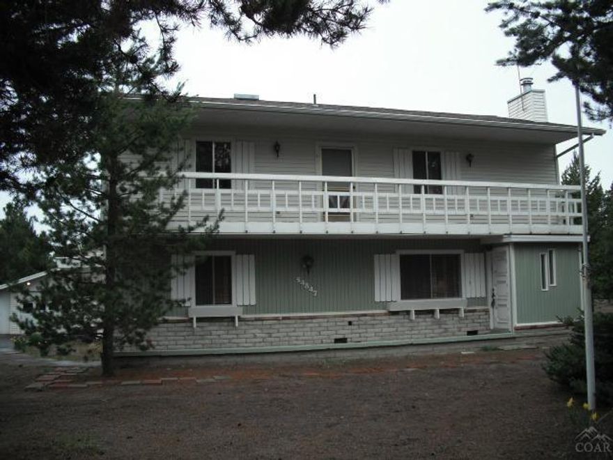 Riverfront-1.60 acres with paved maintained road. This frame home has 1956 sq ft 2 bedrooms and bath upstairs with a family room. Master bedroom is located down stairs. Has a 4- car garage attached, workshop area behind garage, dog run and landscaped. downstairs totally remodeled all new floors ,Must see new carpets, some new cabinets, counter tops,new lino in bath and kitchen. Property has 2 wells and an exterior building that would make a horse barn or RV cover. Fish on your own riverbank.