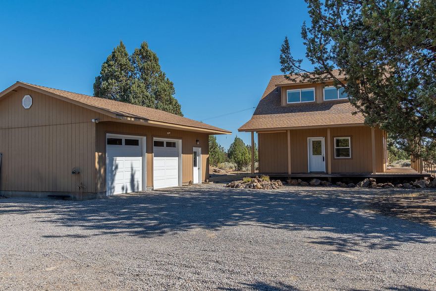 You will fall in love with this custom home & all its amenities! From the wrap around porch, to the bayed French doors leading to the outside water feature, to the hardwood flooring, this home exudes quality!  The main level is open, and includes a beautiful fireplace, with mantel and the ability to use propane or wood.  Enjoy a luxurious bath while relishing nature, just beyond the large picture window, or utilize the ample size showers.  No lack of storage. The builder used every inch of excess space for storage. Access miles & miles of public land, from your rear property line, for hiking, riding, or ''wetting-A-line'' in the infamous, Deschutes River.  The fenced-in garden is ready for next year's planting and the 896 SF garage boasts 2-bays, a shop,1/2 bath and a studio, for the artist or long-arm quilter. What's not to love in this 1554 SF home, on a 3.84-acre private acreage! At night the only light you will see is a thousand stars in the sky, not the light from your neighbors