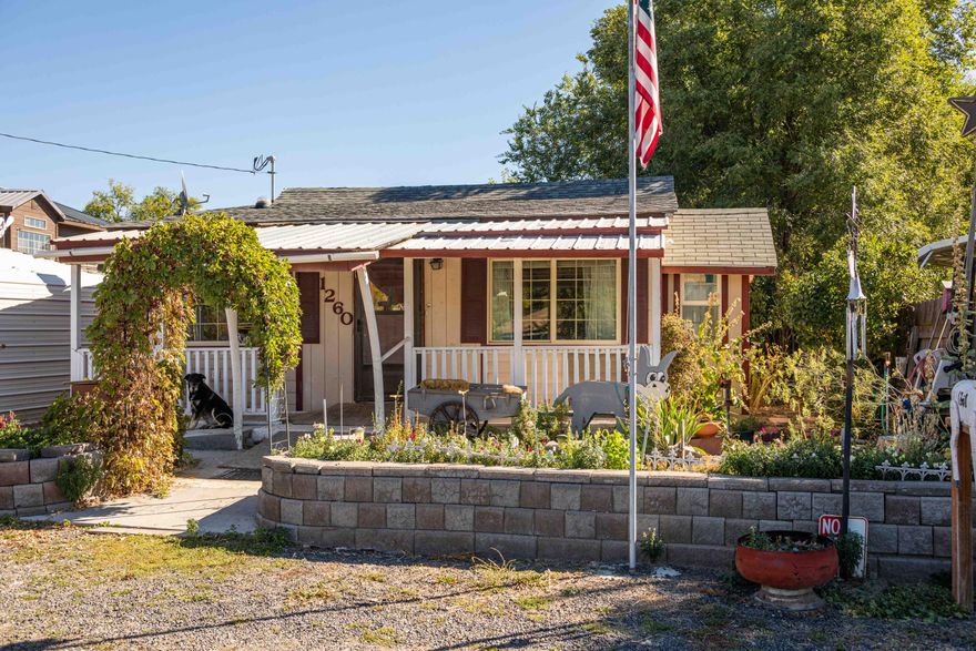 Check out this cottage with large lot in a quiet neighborhood on the edge of town. Bring your vision, and some elbow grease to make this a great home. Home is zoned C2
so endless possibilities on usage. Could be a business or investment property. House is 1,344 sq ft of living space with 2 bedrooms and 1 bath. Living room has gas heater
to efficiently heat the house. Covered back porch, large lot with newer metal carport, double gate to access back yard where there are multiple outbuildings, covered
storage, rv parking, and small hobby shop. House is connected to private well.