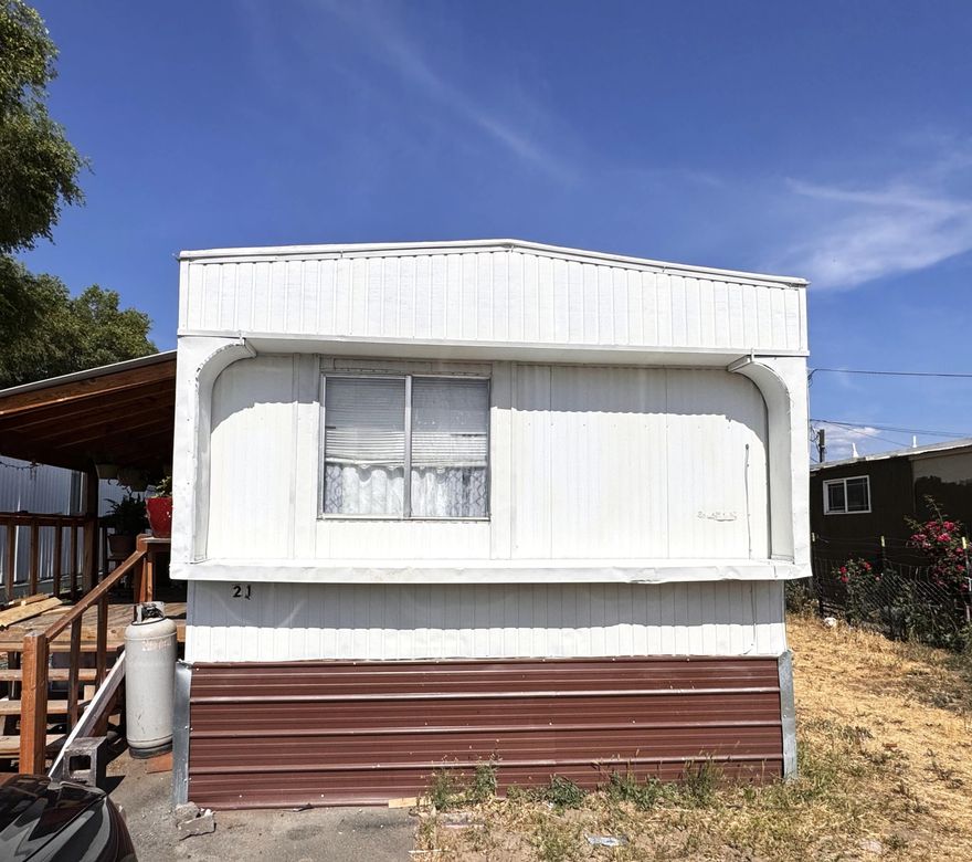 Affordable opportunity in Central Oregon! This 2-bedroom, 2-bath single-wide offers a rare layout with a living room bump-out for extra space and comfort. Fresh exterior paint gives it a clean look from the curb. Home needs some repairs and updating—but at just $30,000, it's a chance to create value and build equity with your own updates. Located in a quiet park, this is your chance at low-cost living or a budget-friendly project.