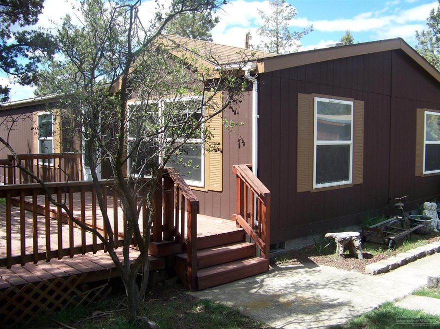 Owners have done an incredible job making this property truly special. Beautifully remodeled home with a completely self contained 40 X 30  apartment for guests or other family members. Large 16 X 30 Man Cave decorated with  car nostalgia display items and a billiard table not included in the sale price.  Big nice decks out back for relaxing and BBQ. Large metal building is a  24 x 36 ventilated workshop that owner uses as a paint booth and for auto restoration, very CLEAN. 220 power. Also three 10 X 20 storage outbuildings.  Land is fully fenced and maintained. There is just lots here to see. This is move in ready.