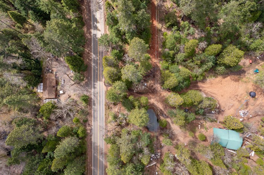 Discover your own private retreat nestled on 2.84 acres, backing up to BLM land. This unique property features two homes separated by Caves Highway, offering a possible setup for multi-family living or rental income. The property is situated near Sucker Creek and just a brief 10-minute drive from Cave Junction. This property is being sold as-is and requires some TLC to reach its full potential. Cash offers and rehab type loans, providing an excellent opportunity for investors or DIY enthusiasts to add value and create their dream oasis.
All information is deemed reliable but not guaranteed. Anyone considering purchasing this property should perform their own investigation into the uses and condition of the property. Buyer to do their own due diligence.