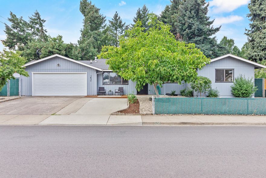 Discover this well maintained, 3 bedroom 2 bathroom nestled in a quiet neighborhood on a large corner lot. Featuring a beautiful brick fireplace in the living room, fresh interior paint, new lights and fixtures, new water heater, dishwasher and garage door.  The large bonus room has ample storage and a built-in desk, perfect for work or hobbies, Unwind in the hot tub after a long day or enjoy outdoor gatherings under the spacious covered patio. . The backyard is a private peaceful retreat, highlighted by a concrete walking path lined with evergreen trees providing year round shade. Fruit lovers will enjoy a variety of established fruiting trees, including apple, figs, cherries, plums, apricots, grape vines and a stunning walnut tree in the front yard. The property offers a separate gated storage yard, RV/barn workshop, several outbuildings. This is a rare and unique property you won't want to miss!