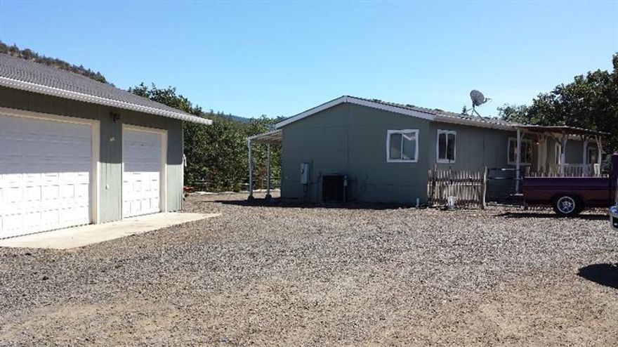 Just down the road from Stone Ridge Golf Course and Agate Lake. This 2001, 4 bedroom 2 full bath Double Wide sits on almost 4 usable fenced & cross fenced acres with electric gate. Newer heat pump, 3 car garage/shop, 2 metal carports and even an above ground pool. High producing well was 60 gpm on last flow test, new pressure tank and filtration systems. Peaceful country setting with mountain views, this is not a through traffic area of E. Antelope Road. Great for horses, 4H animals, large garden area with two storage sheds. Close to town and services, sellers are moving and have priced this property to sell!